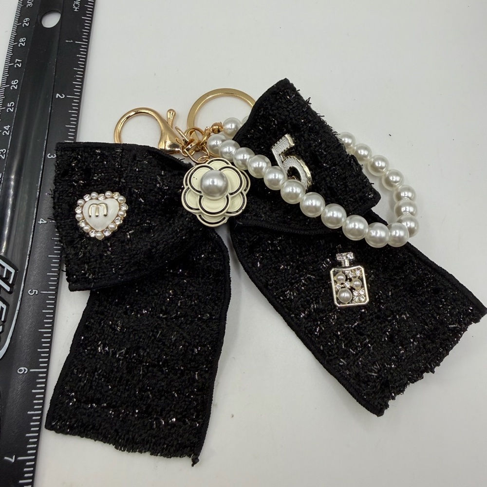 Elegant Black Bow Keychain with Pearl Accents